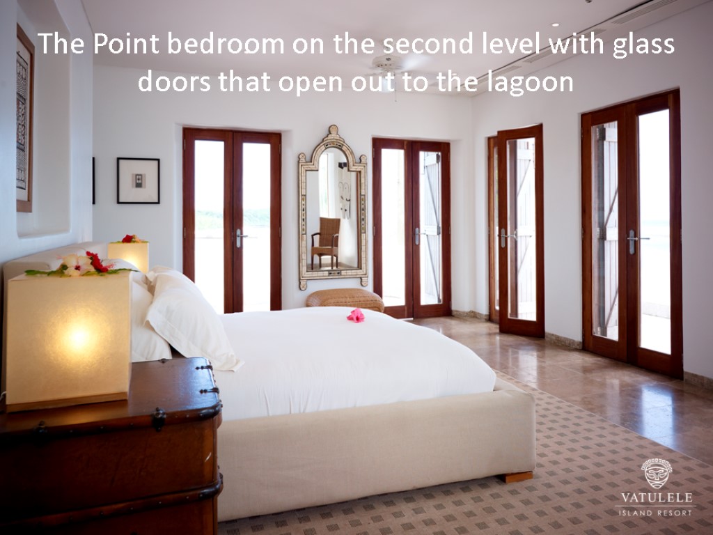 The Point bedroom on the second level with glass doors that open out to